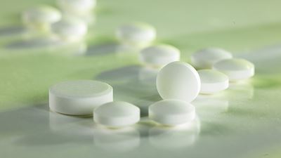 White Tablets on Green background