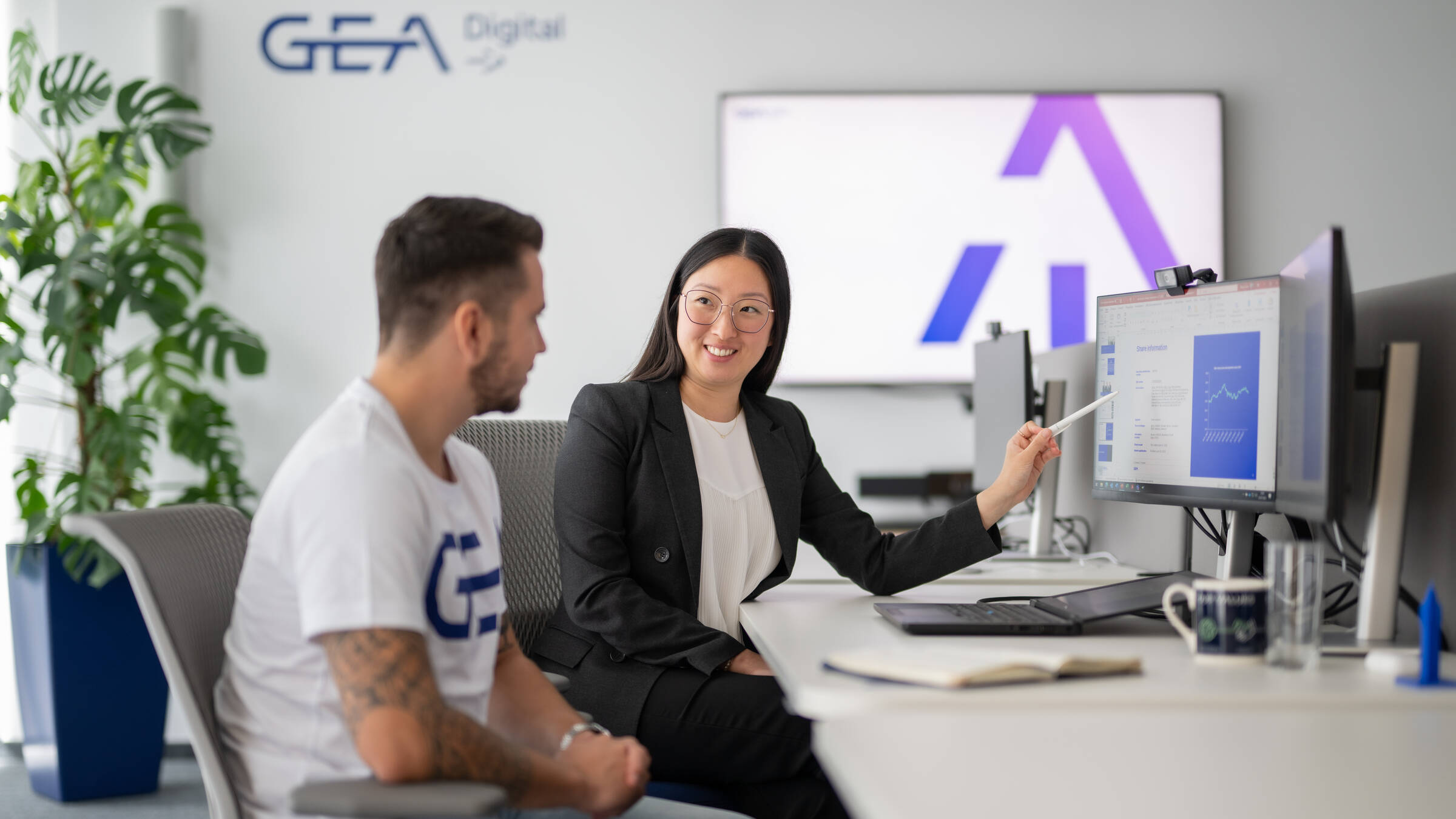 GEA employees discussing career development