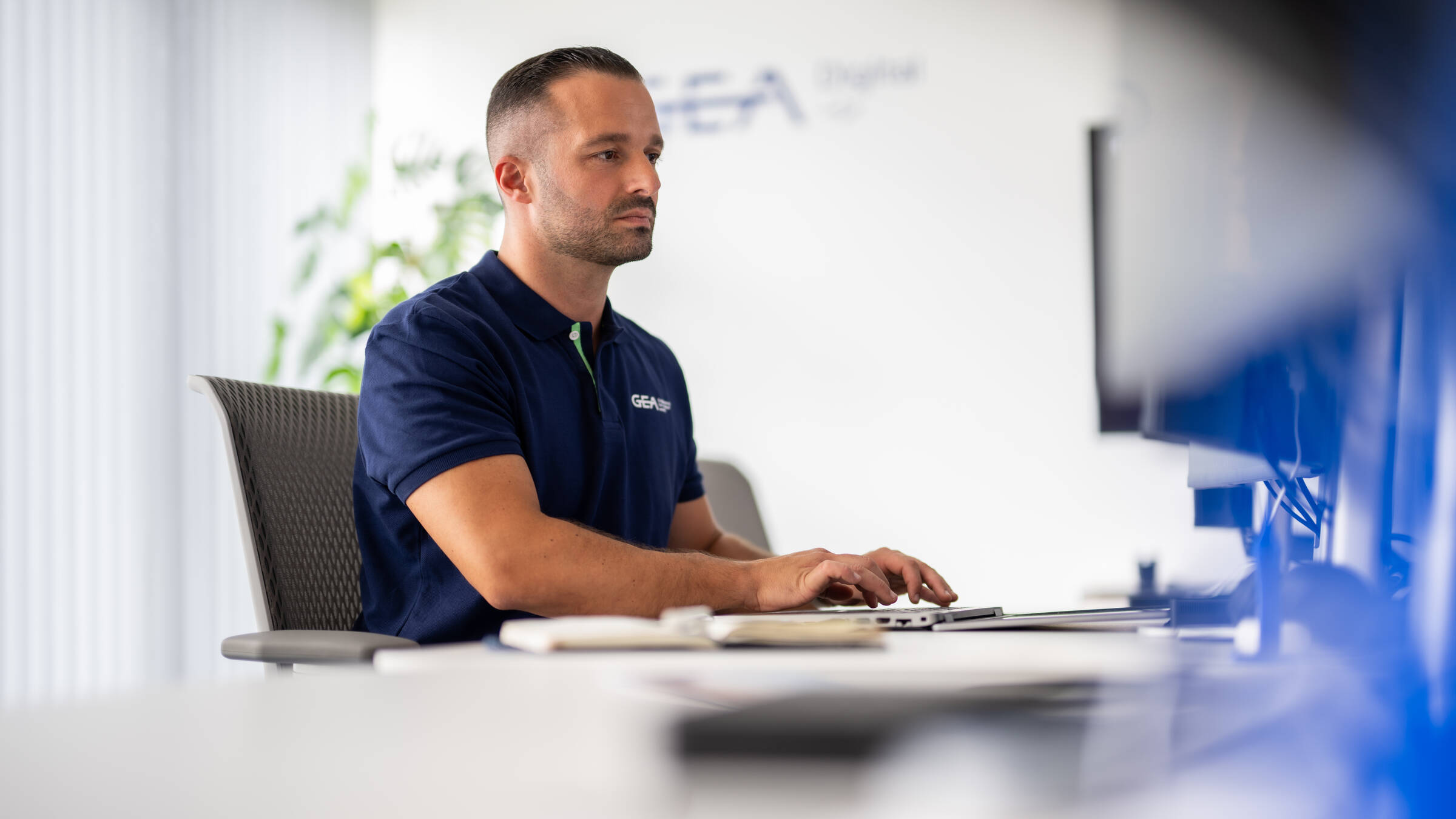 GEA employee working in the office