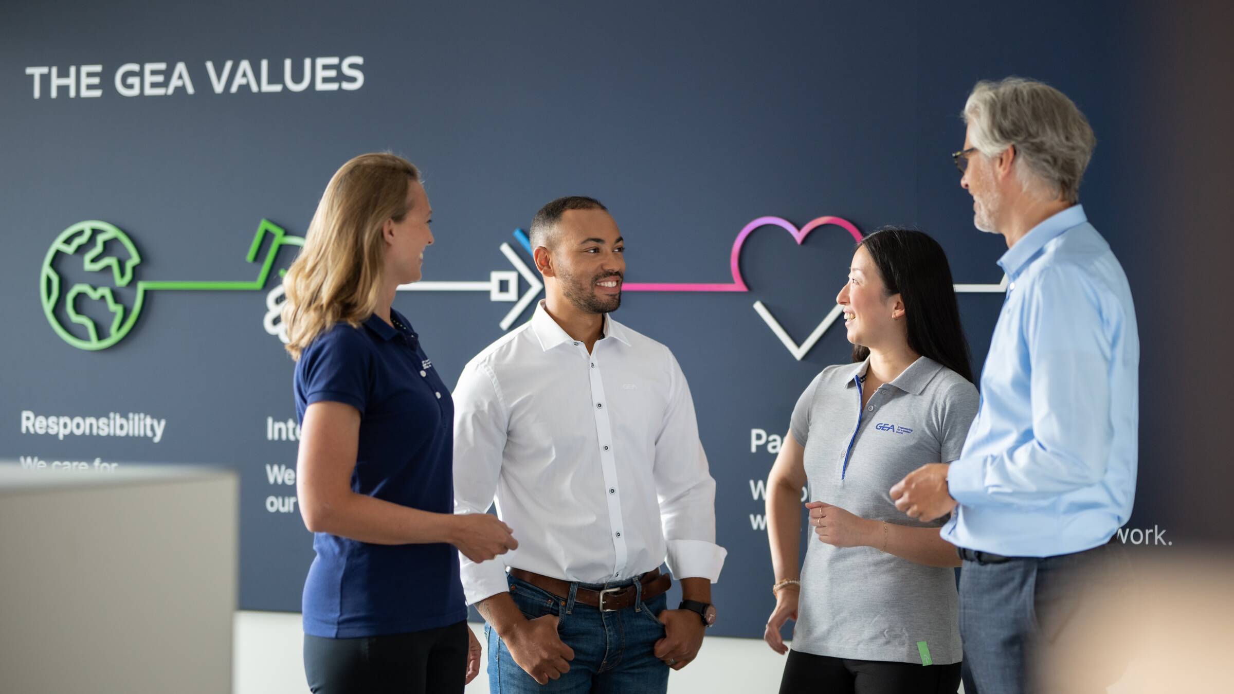 GEA employees discussing 