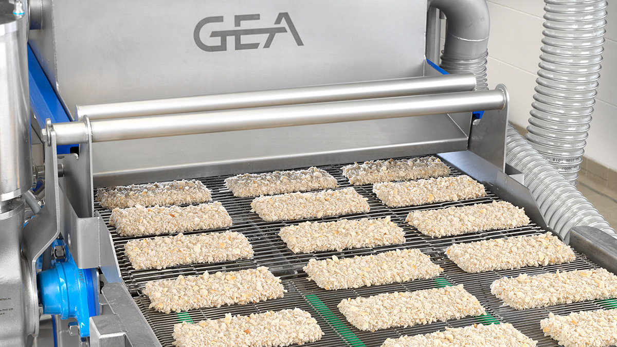 GEA CrumbMaster Gen 2 - crumb coating machine outfeed with sourdough crumb coated products
