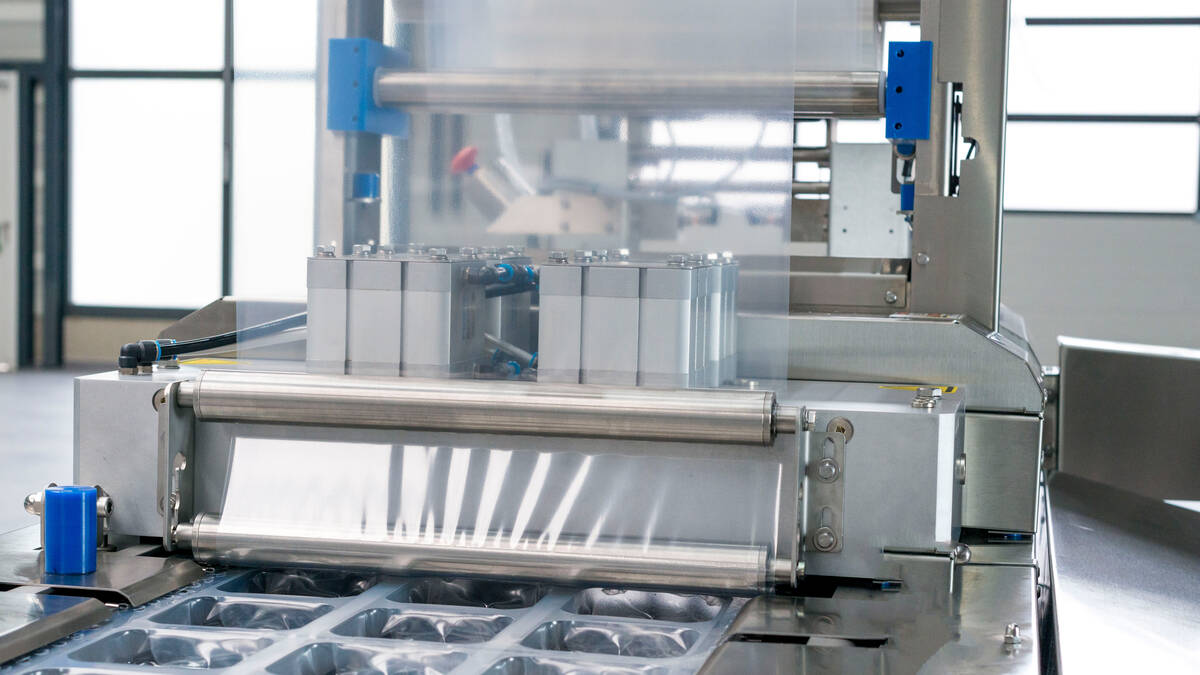 GEA PowerPak 1000 | Entry level Thermoforming packaging machine | motorized film unwinding and guiding system